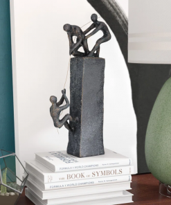 gray polystone people climbing decorative sculpture with bronze detailing, 7" x 3" x 17"