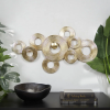 metal stacked circle ring abstract gold wall decor with groove texture