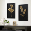 gold flowers and plants with black wood back and frame wall decor