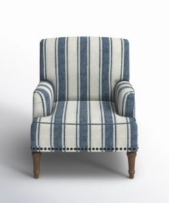 arching armchair with solid wood legs and nailhead trim