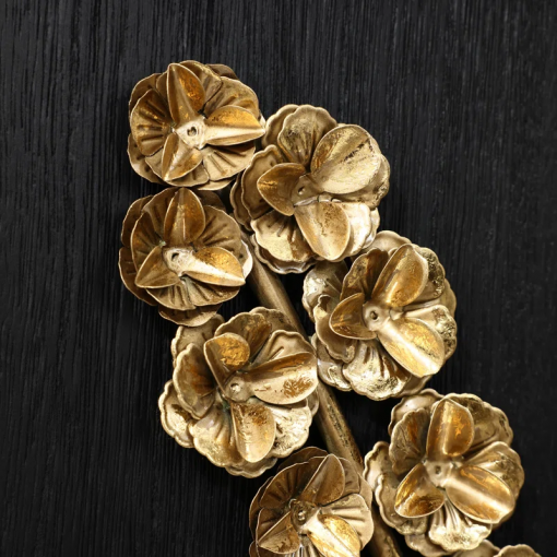 gold flowers and plants with black wood back and frame wall decor