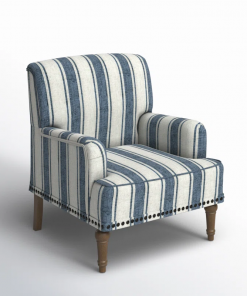 arching armchair with solid wood legs and nailhead trim