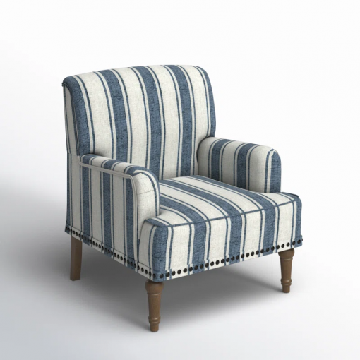 arching armchair with solid wood legs and nailhead trim
