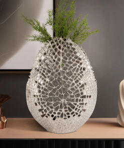 decorative aluminum vase with organic cutout design sculptural metal accent piece modern abstract openwork motif freestanding etched detailing artisan style vase contemporary home decor element.